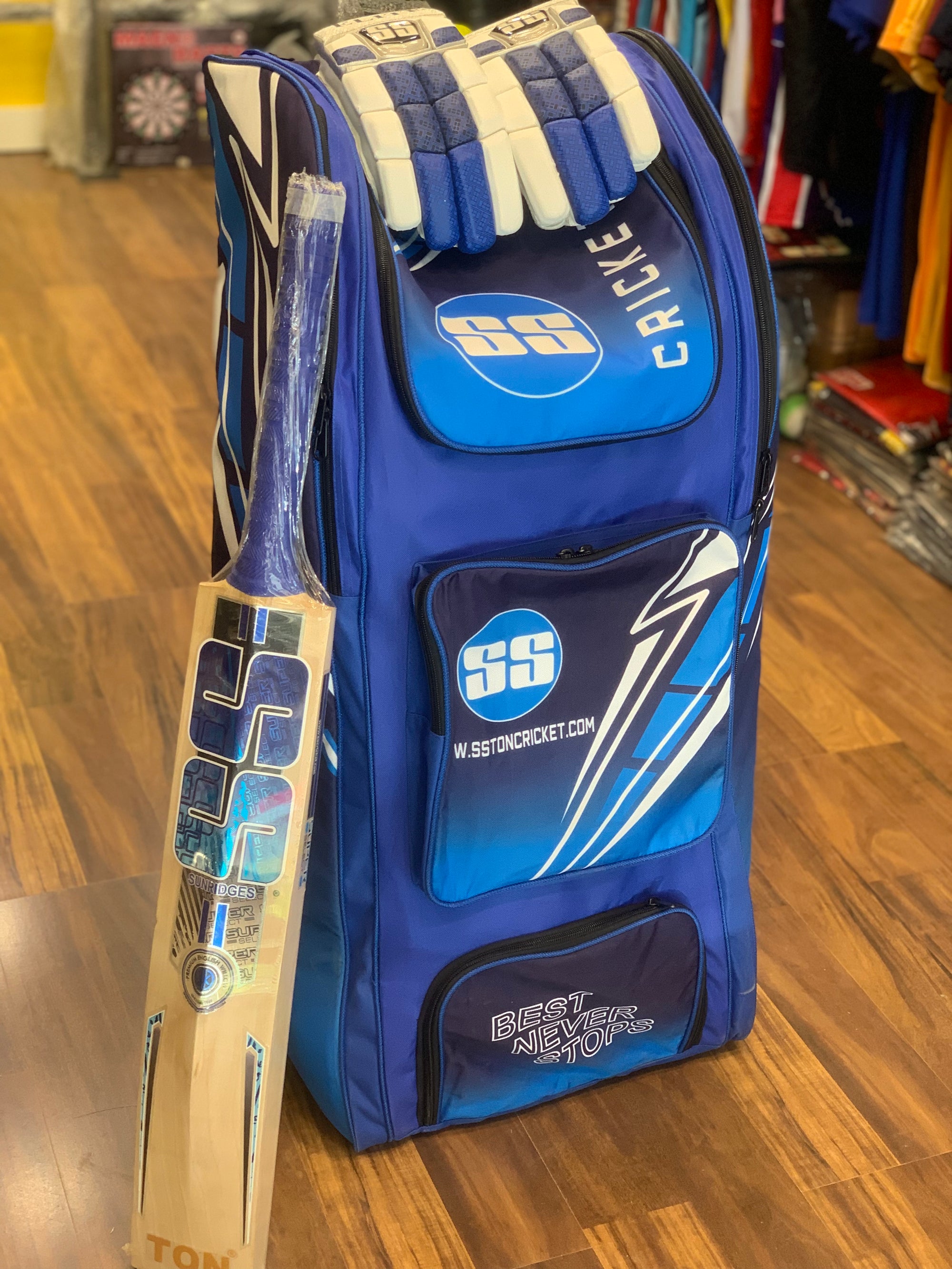 SS Select Duffle Cricket Kit Bag along with a cricket bat and batting gloves